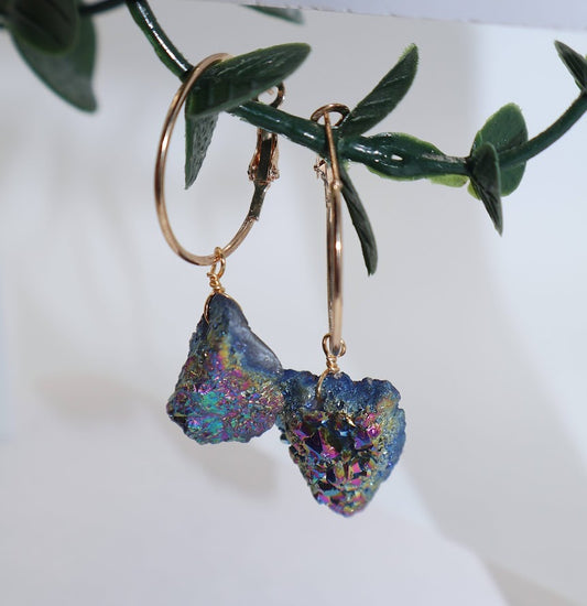 Gold hoop earrings with colorful Cosmic Charm Hoops.