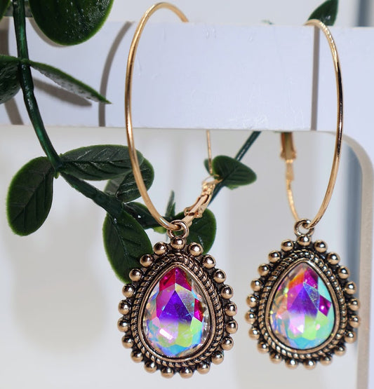 Gold earrings featuring a stunning teardrop crystal that shimmers with a rainbow of colors, framed by delicate rose gold accents.