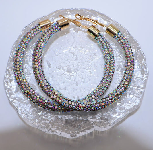 A pair of  dazzling hoop earrings and are adorned with shimmering crystals.