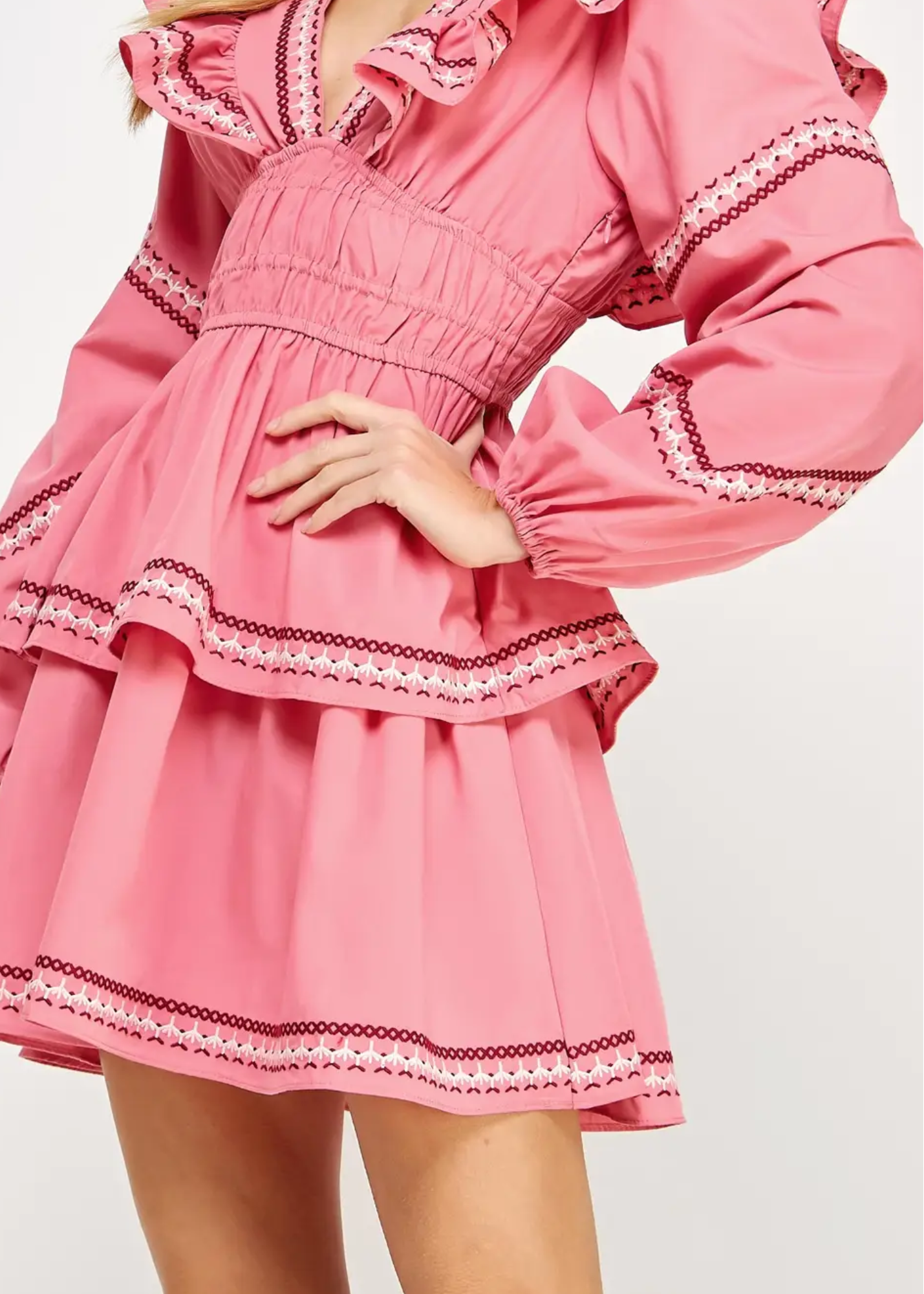 Ruffled Tiered Mini Dress is a charming and feminine piece that exudes elegance and playfulness. Designed with layered ruffles and intricate trim details.