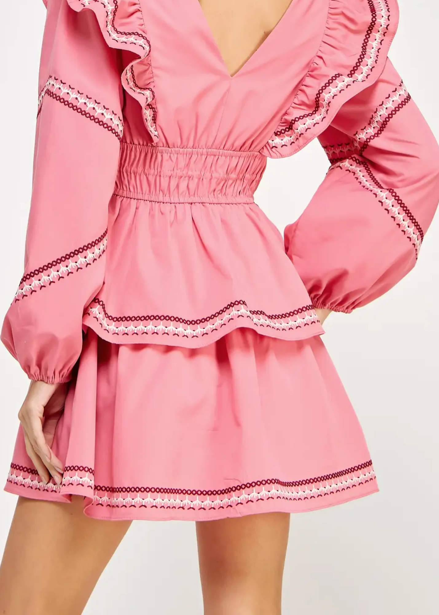 Ruffled Tiered Mini Dress is a charming and feminine piece that exudes elegance and playfulness. Designed with layered ruffles and intricate trim details.