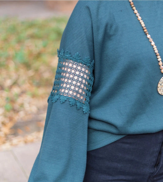 Teal Green Lace Accent Top is a perfect blend of comfort and style. Featuring delicate lace details on the sleeves and a relaxed fit.