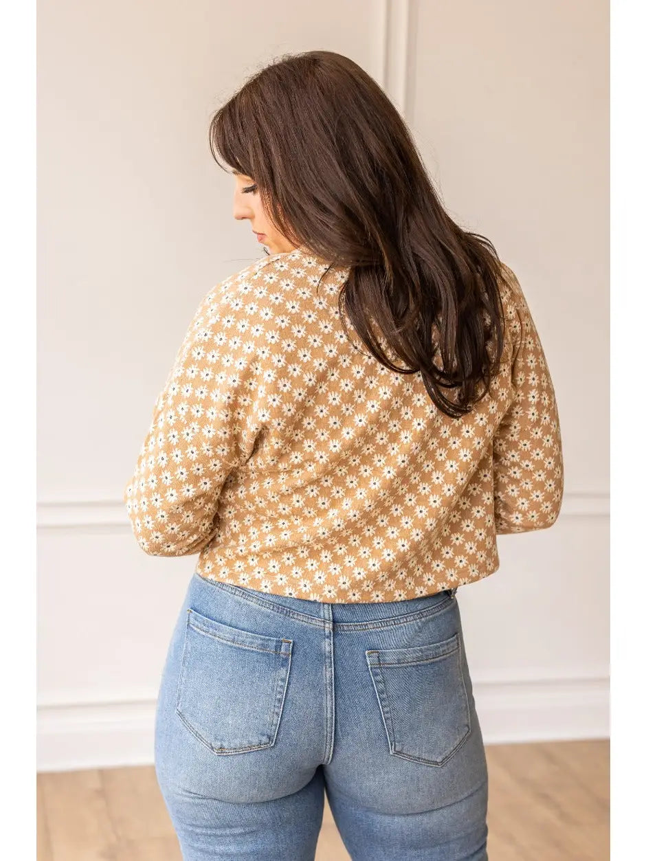 Floral Cropped Jacket is a versatile and stylish addition to your wardrobe. Featuring a charming daisy print and a cropped fit.