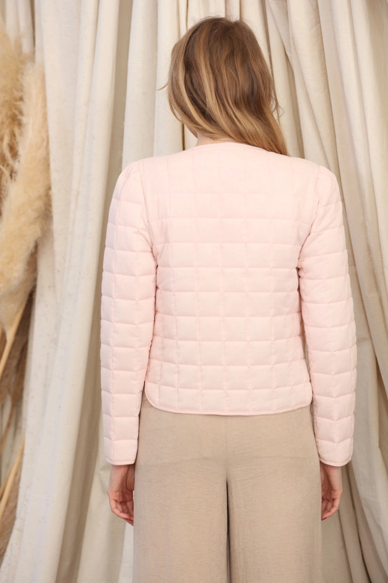Reversible Quilted Jacket is a versatile and stylish layering piece that combines comfort with timeless charm. Crafted from voile fabric, this jacket features a quilted, patchwork print design and a flattering V-neckline.