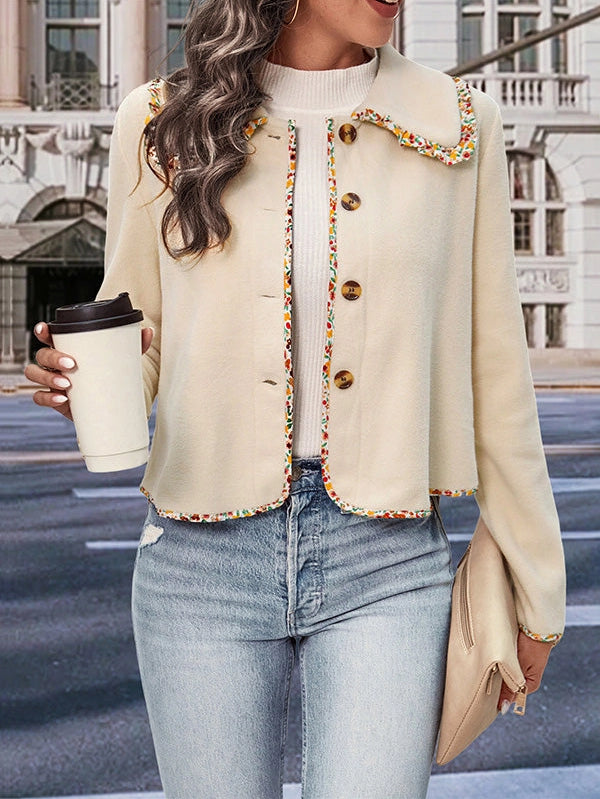 Buttoned Lapel Jacket is a stylish and versatile piece designed for a polished yet relaxed look. this jacket features a loose fit and long sleeves for effortless comfort.