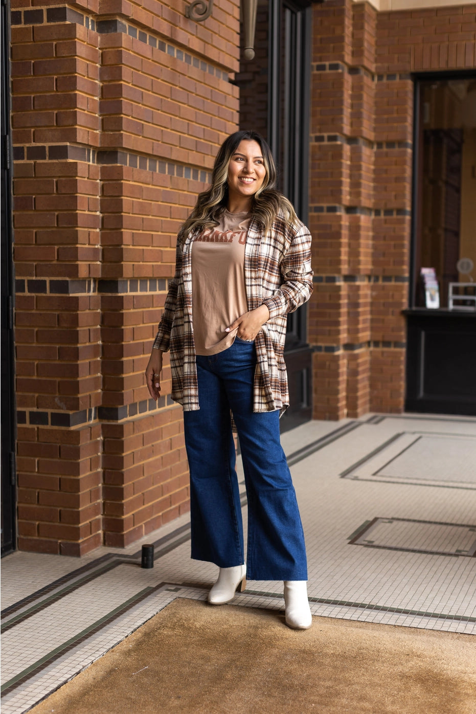 Plaid Flannel Shirt Dress is a versatile wardrobe essential that works beautifully as both a dress and a lightweight jacket.