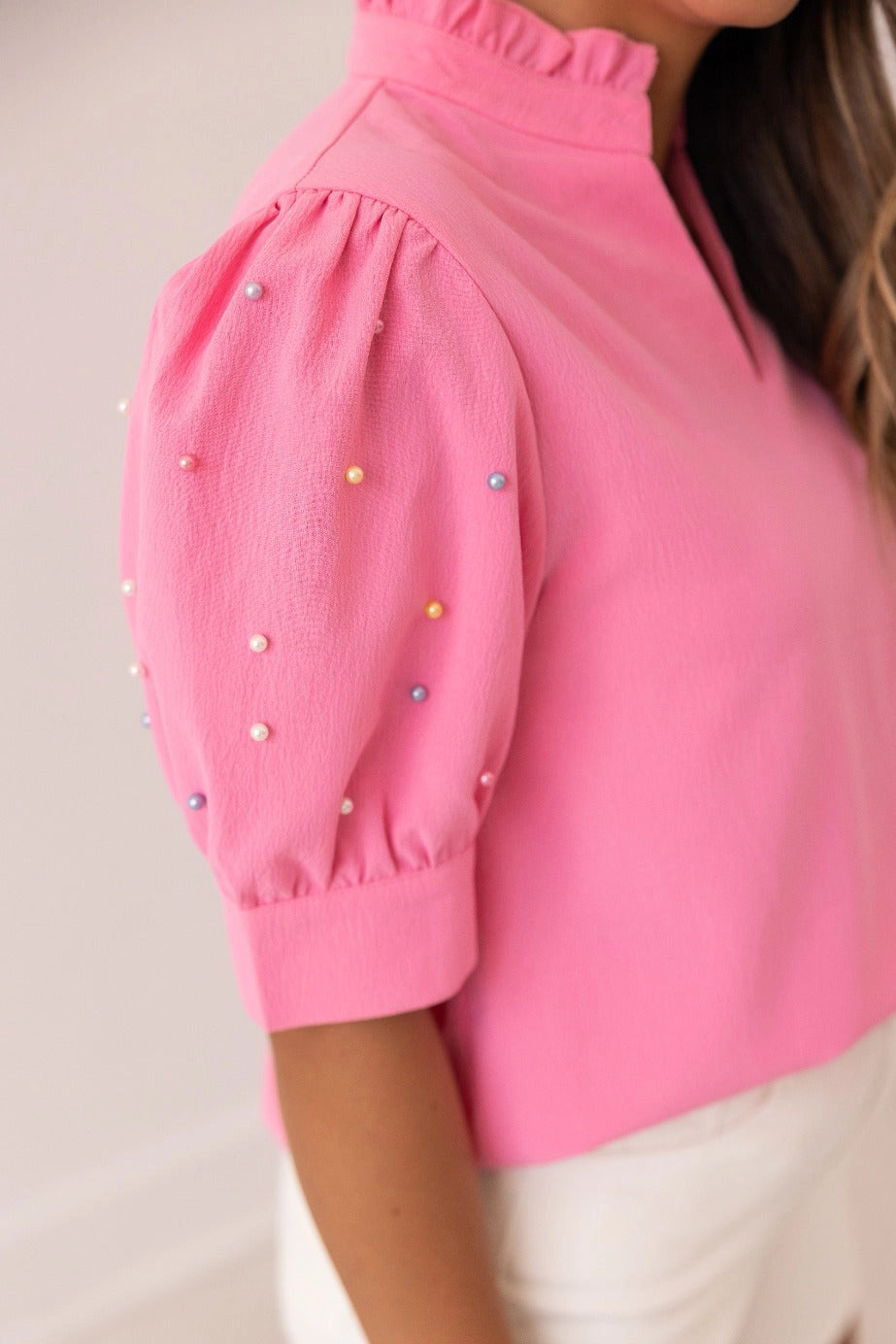Embellished Blouse is a playful yet sophisticated choice for any occasion. Featuring puff sleeves with delicate embellishments and a split neckline.
