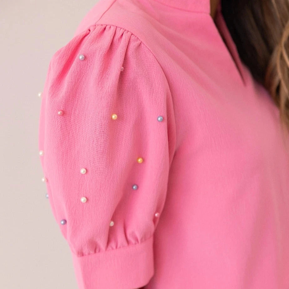 Embellished Blouse is a playful yet sophisticated choice for any occasion. Featuring puff sleeves with delicate embellishments and a split neckline.