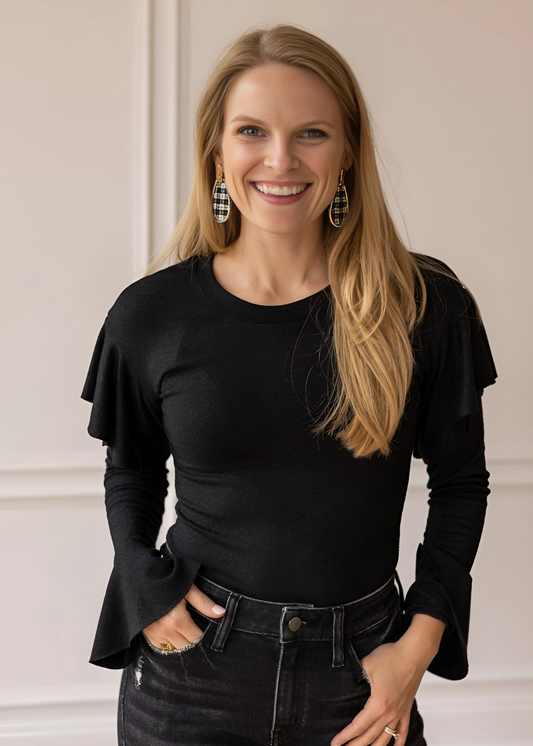 Ruffle Bodysuit, featuring a sleek, shimmering black fabric.