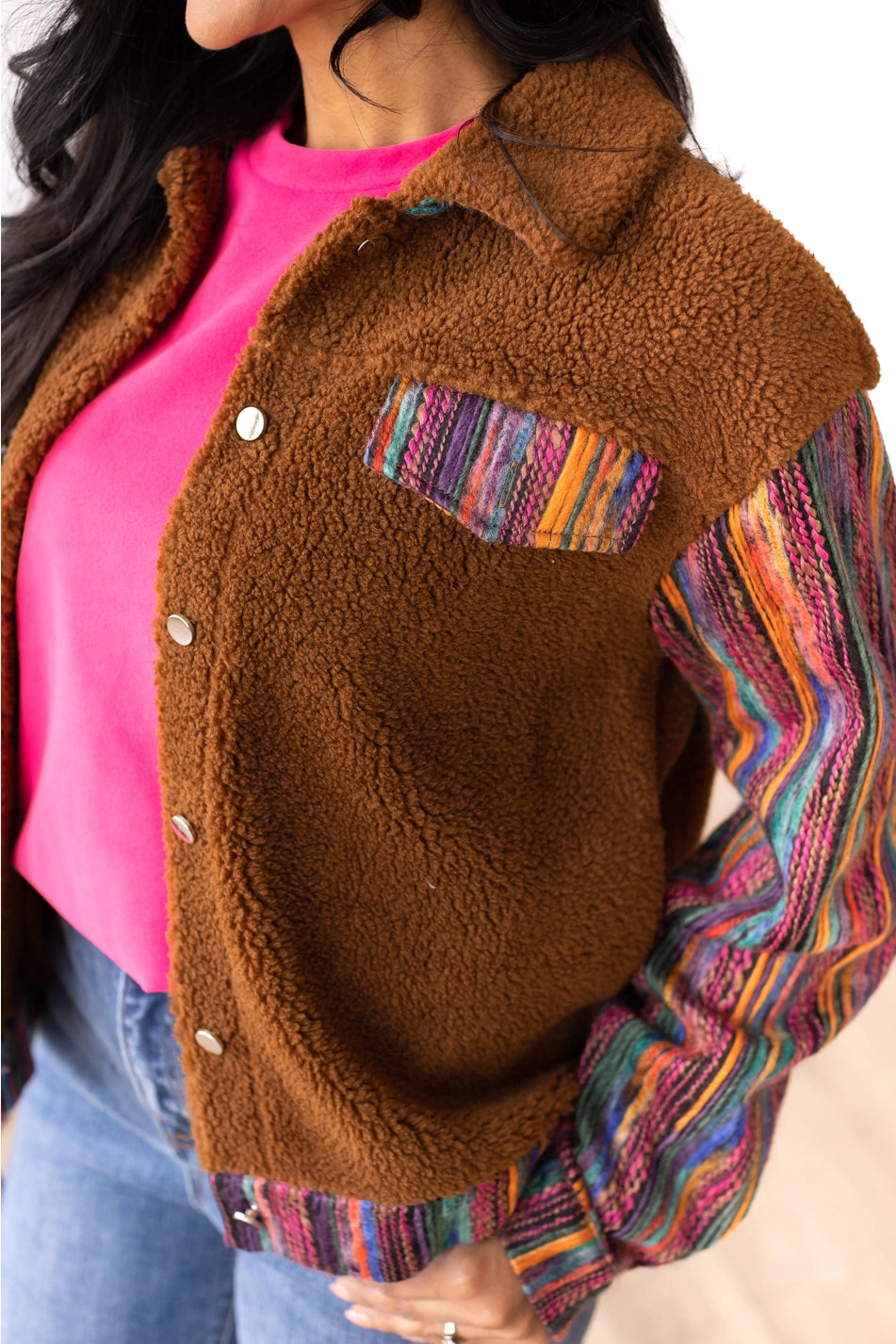 Sherpa Jacket with a cozy and stylish piece that combines comfort with bold, colorful accents.