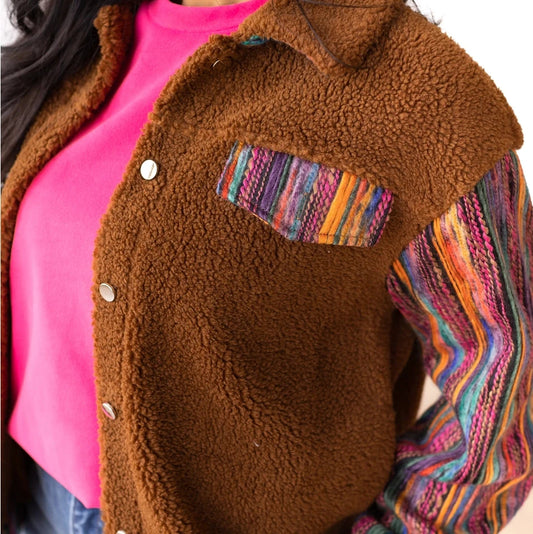Sherpa Jacket with a cozy and stylish piece that combines comfort with bold, colorful accents.