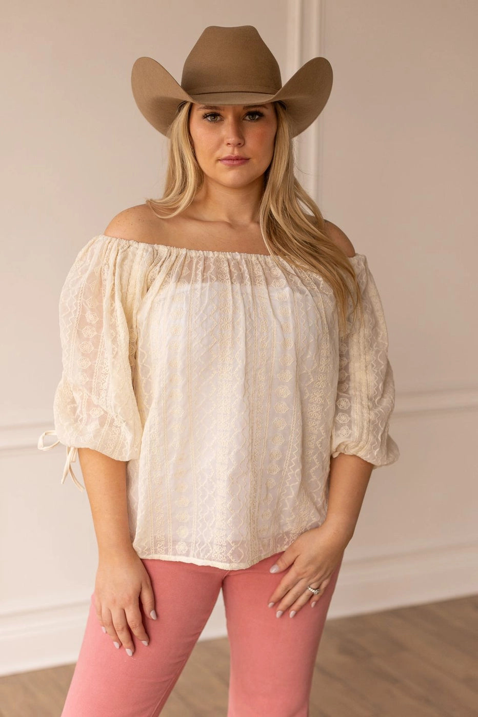 Peasant Blouse exudes effortless charm with its relaxed fit and lightweight feel. Featuring adjustable sleeves and a matching belt crafted from the same fabric.