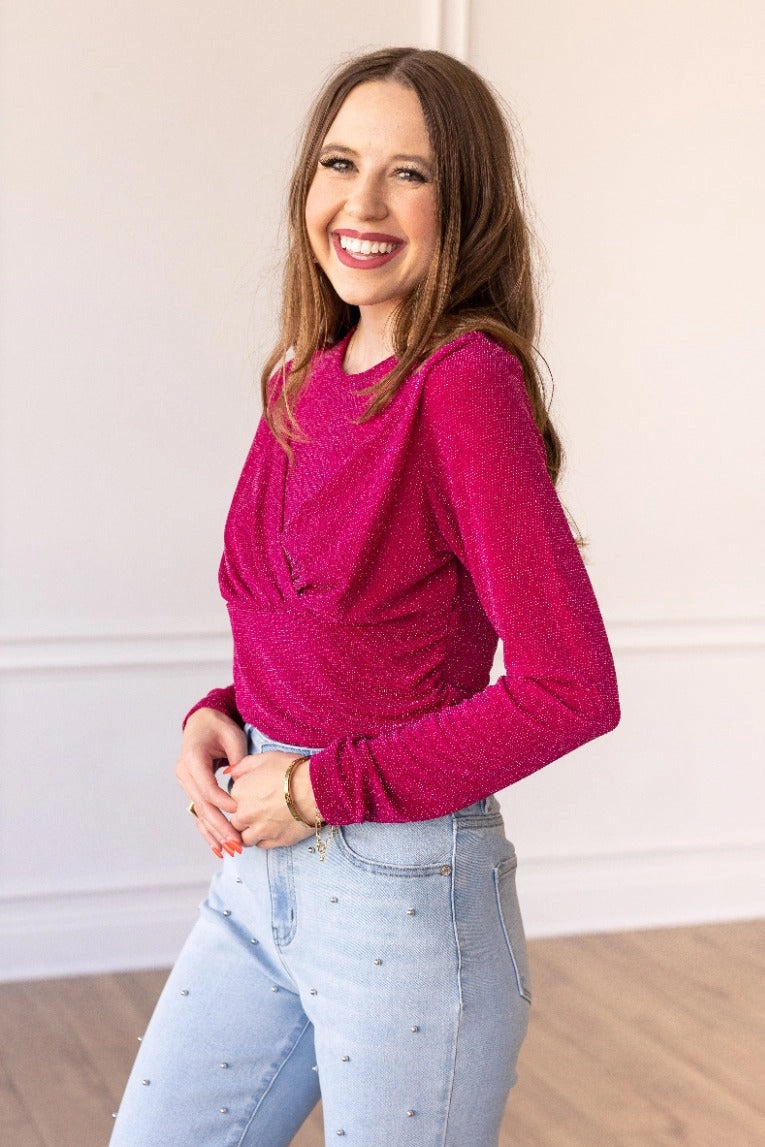 Hot Pink Sparkle Bodysuit brings a touch of elegance and shimmer to your wardrobe. Featuring a crew neck, high stretch fabric, and snap closure for easy wear.