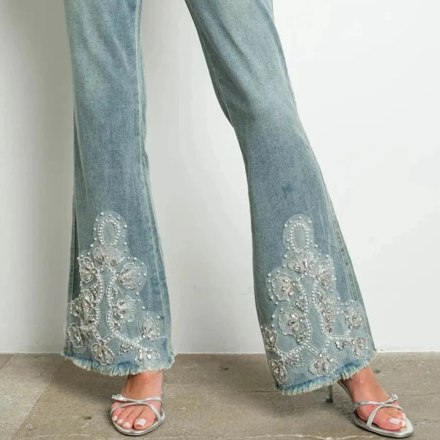 Beaded Lace Bell Bottom Jeans offer a stylish nod to vintage fashion with a modern twist.