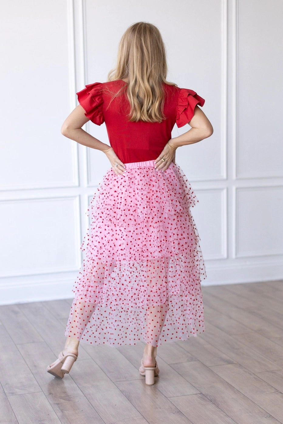 Heart Tiered Tulle Skirt is a whimsical and romantic piece perfect for adding a playful touch to your wardrobe. Featuring multiple layers of soft tulle adorned with delicate heart patterns.