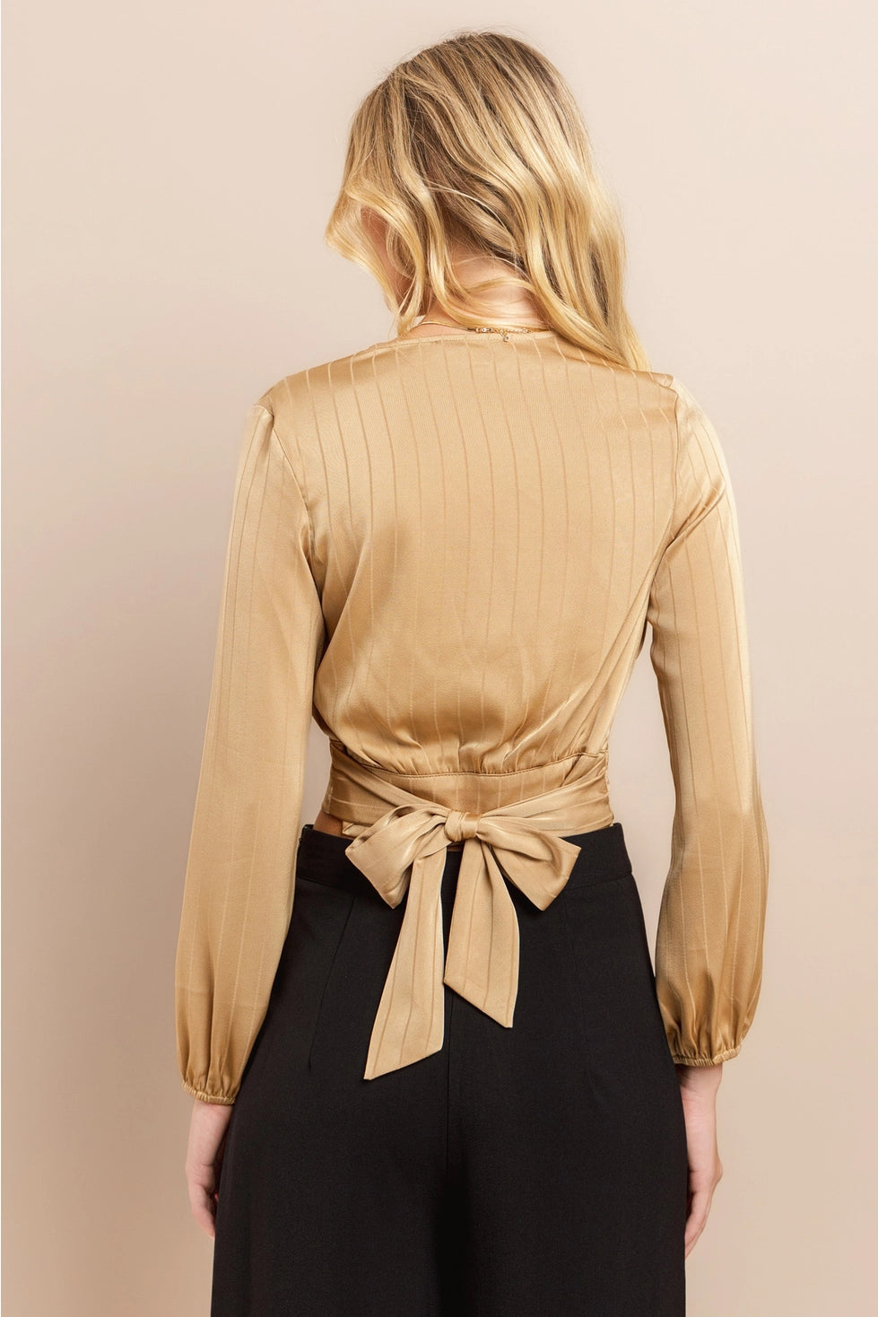 Beige Wrap Crop Top Made from lightweight polyester, this top features a flattering wrap design with a deep V-neckline and long sleeves.