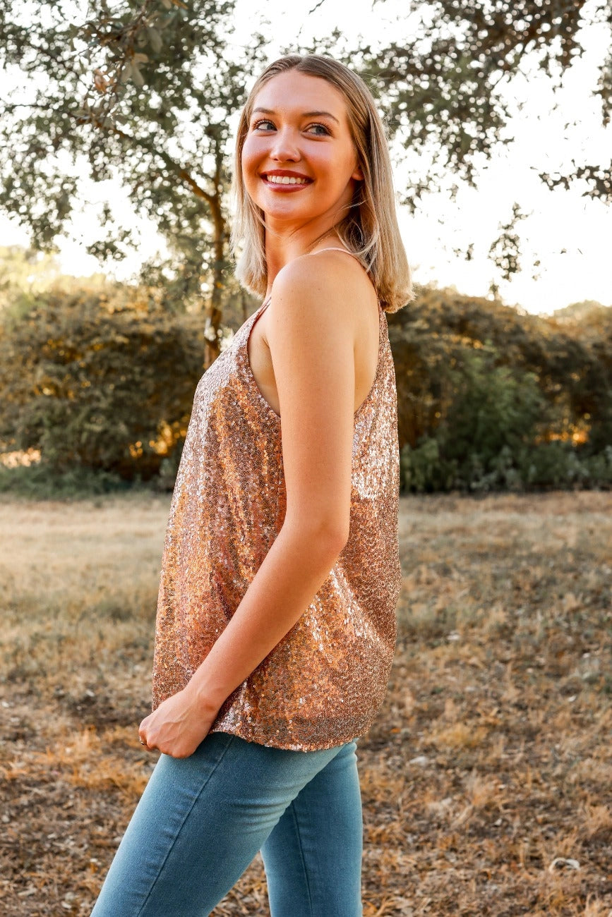 Rose Sequin Cami Top is a glamorous and eye-catching piece, perfect for special occasions or adding sparkle to your everyday look. Designed with a relaxed fit, this top features shimmering sequins throughout.