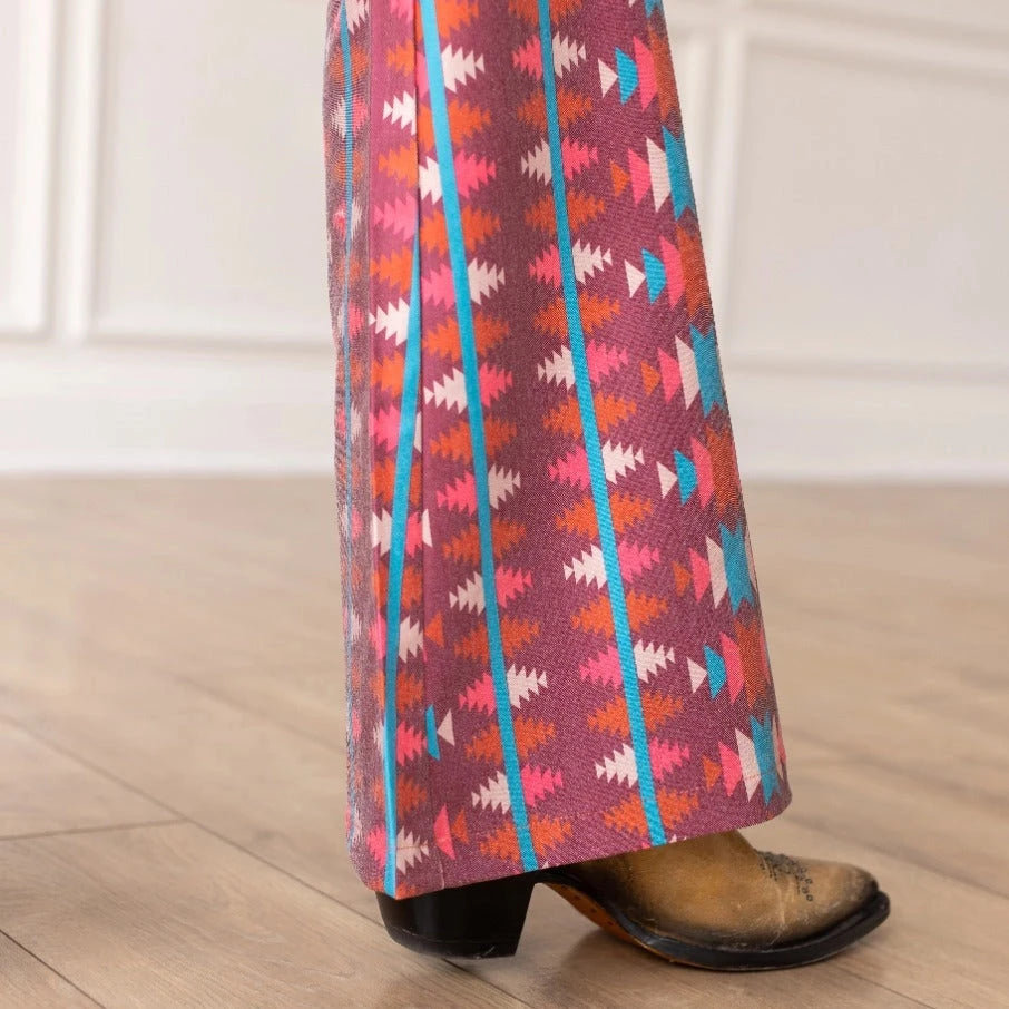 Aztec Flare Pants are a bold and stylish choice, designed to make a statement. These fitted pants feature a vibrant Aztec-inspired pattern and a flattering flared silhouette.