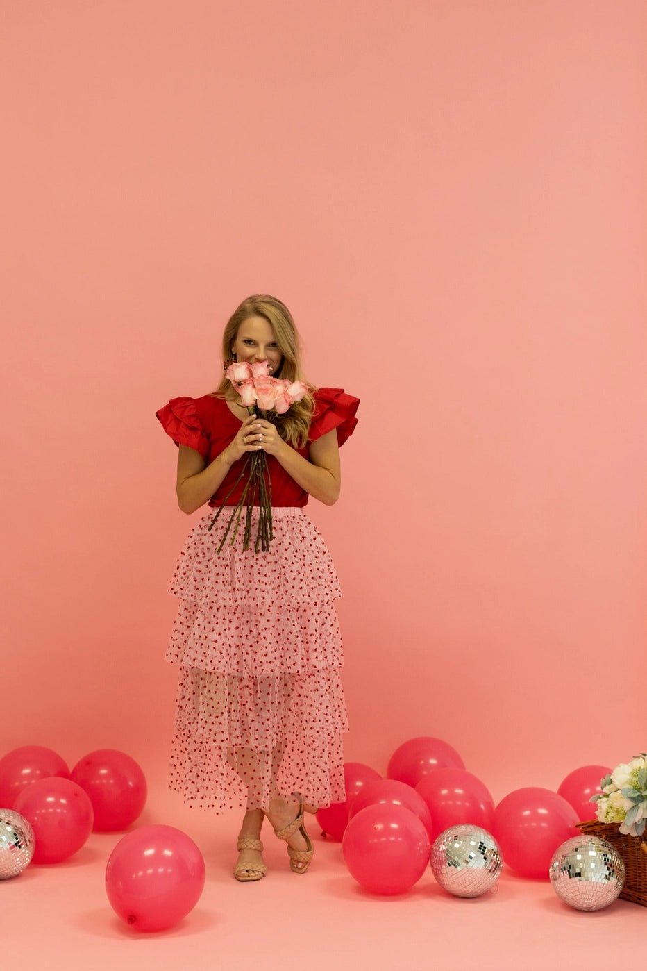 Heart Tiered Tulle Skirt is a whimsical and romantic piece perfect for adding a playful touch to your wardrobe. Featuring multiple layers of soft tulle adorned with delicate heart patterns.