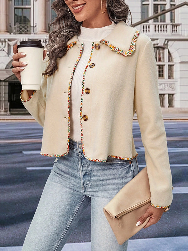 Buttoned Lapel Jacket is a stylish and versatile piece designed for a polished yet relaxed look. this jacket features a loose fit and long sleeves for effortless comfort.