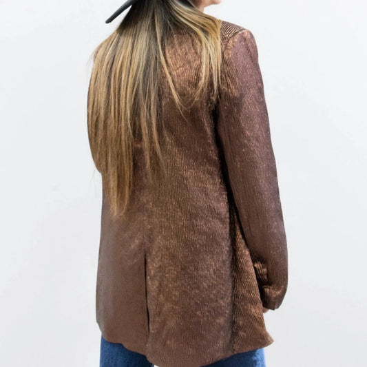 Metallic Blazer is a bold statement piece that effortlessly blends sophistication and glamour. Featuring a sleek metallic sheen, a lined interior, and functional pockets.