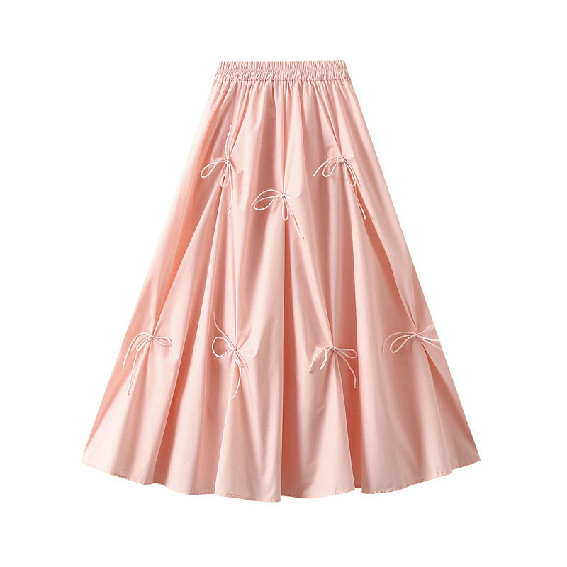 Blush Pink Bow Detail Midi Skirt is a feminine and elegant piece designed to elevate your wardrobe. This flowy midi skirt features delicate bow accents throughout.
