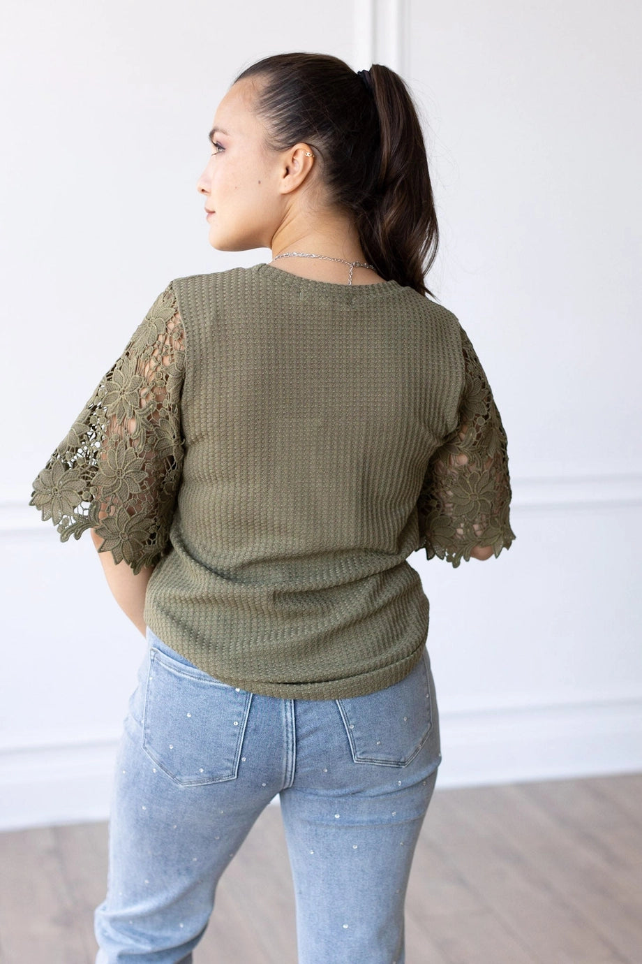 Lace Sleeve Top effortlessly combines comfort and elegance. Featuring a relaxed fit and delicate lace sleeves.