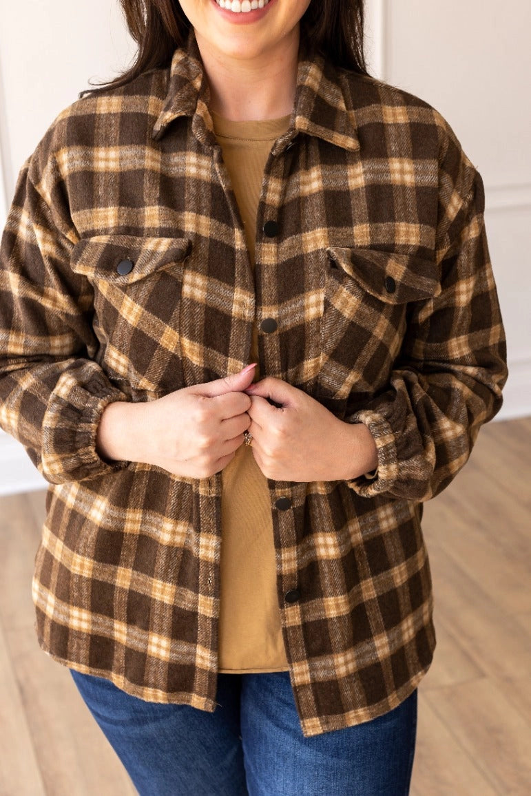 Oversized Plaid Shacket is the ultimate blend of comfort and style. Featuring a classic plaid pattern and an oversized fit.
