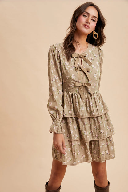 Bow Tie Floral Dress is a playful and feminine piece that combines charm and sophistication. 