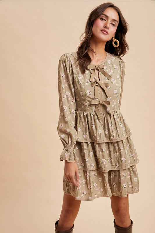  Bow Tie Floral Dress is a playful and feminine piece that combines charm and sophistication. 