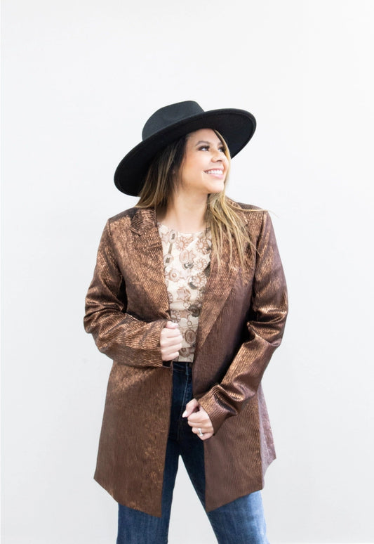 Metallic Blazer is a bold statement piece that effortlessly blends sophistication and glamour. Featuring a sleek metallic sheen, a lined interior, and functional pockets.