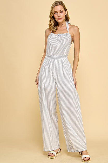 Striped Halter Jumpsuit is a chic and breezy one-piece outfit perfect for warm-weather occasions. Featuring a flattering waistband and a tie-back halter neckline.