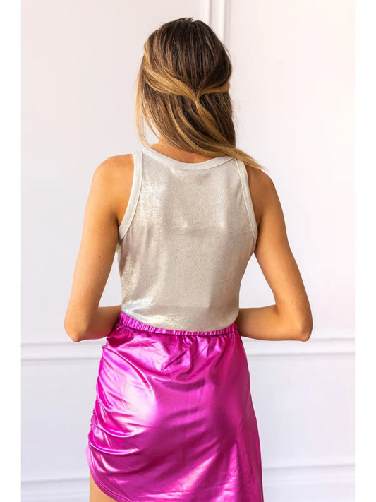 Metallic Bodysuit is a dazzling and versatile piece that elevates any outfit. Featuring a shimmering metallic finish and a sleek, sleeveless design.