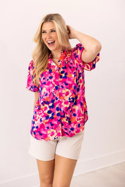  Floral Blouse is a vibrant and stylish addition to your wardrobe. Designed with a button-front closure and chic puff sleeves.