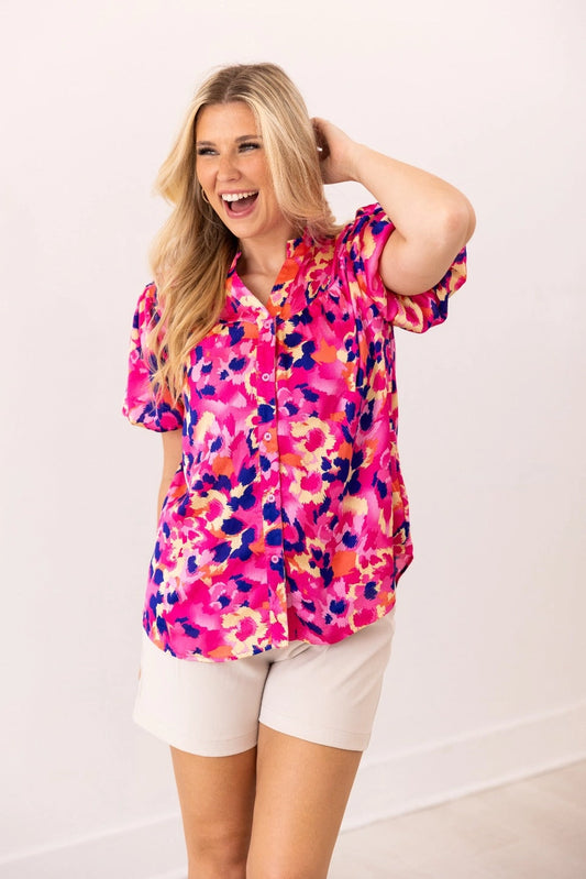  Floral Blouse is a vibrant and stylish addition to your wardrobe. Designed with a button-front closure and chic puff sleeves.