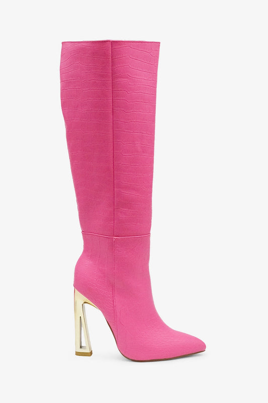  Croc Knee-High Boots are a bold statement piece designed to elevate any outfit. Featuring an eye-catching croc-embossed texture and a vibrant pink hue.