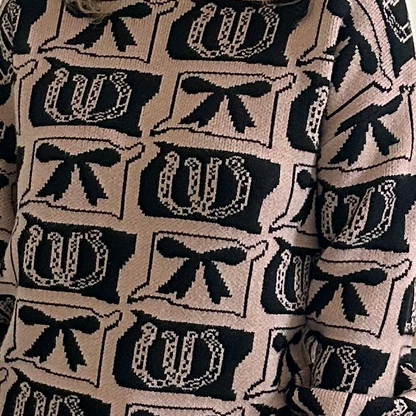Close-up of a sweater with black and white pattern
