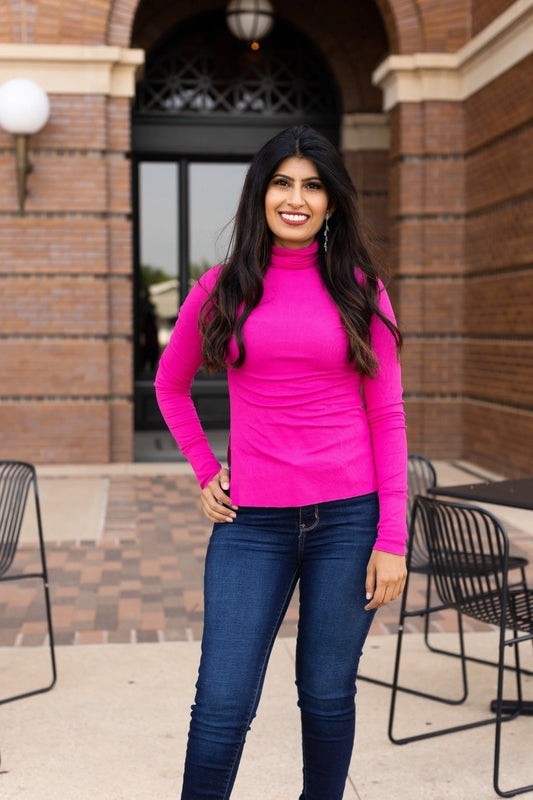 Hot Pink Turtleneck with a fitted design. 