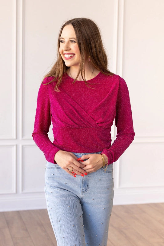 Hot Pink Sparkle Bodysuit brings a touch of elegance and shimmer to your wardrobe. Featuring a crew neck, high stretch fabric, and snap closure for easy wear. 