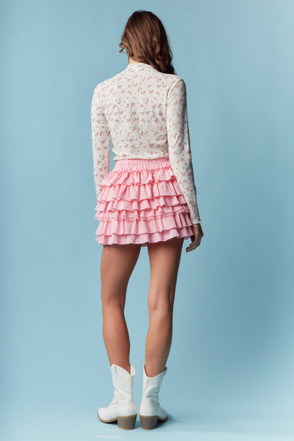 Pink Tiered Ruffle Mini Skirt is the epitome of feminine charm and playful style. Featuring an elastic waistband for a secure and adjustable fit.