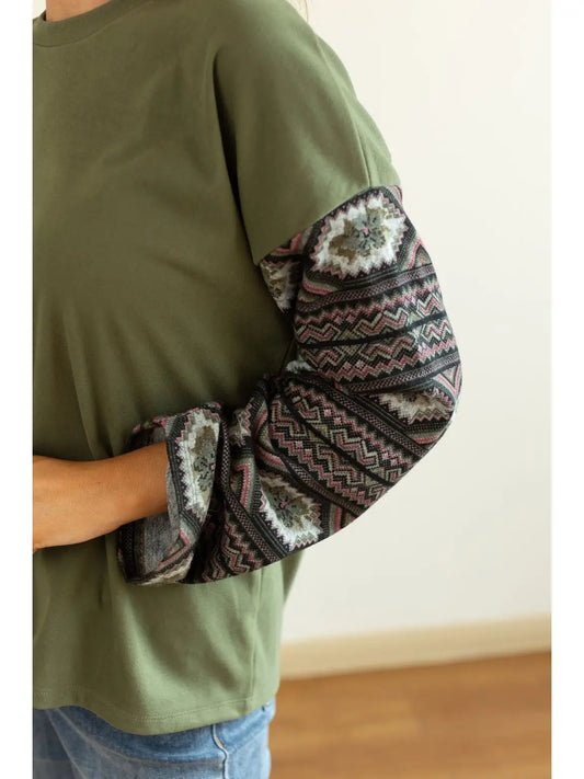 Aztec Sleeve Top is a stylish blend of simplicity and bold design. Featuring a solid olive-green.