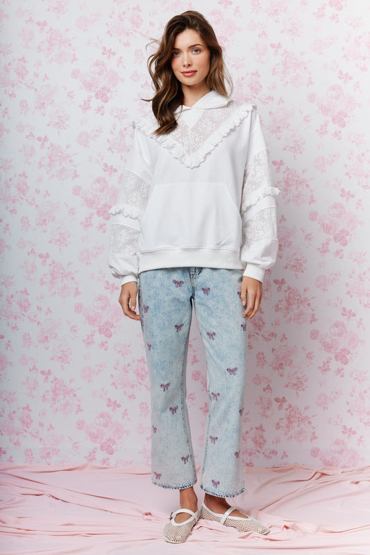  Embroidered Cropped Denim Jeans bring a playful twist to classic denim. Featuring a cropped length and all-over embroidered bow detail.