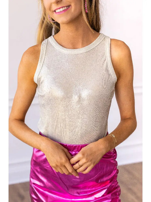  Metallic Bodysuit is a dazzling and versatile piece that elevates any outfit. Featuring a shimmering metallic finish and a sleek, sleeveless design.