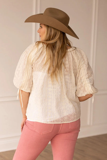 Peasant Blouse exudes effortless charm with its relaxed fit and lightweight feel. Featuring adjustable sleeves and a matching belt crafted from the same fabric.