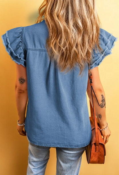 Ruffled Denim Top is a blend of feminine charm and modern style.