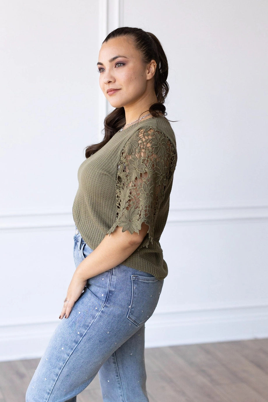 Lace Sleeve Top effortlessly combines comfort and elegance. Featuring a relaxed fit and delicate lace sleeves.