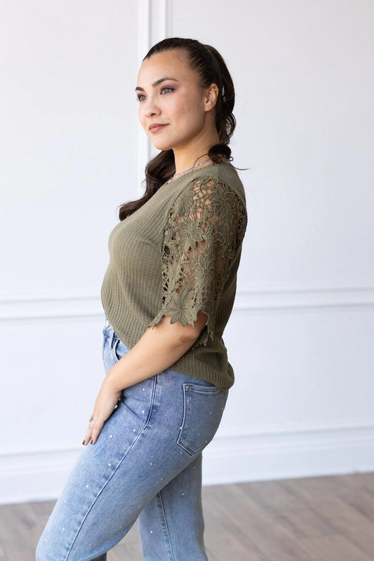 Lace Sleeve Top effortlessly combines comfort and elegance. Featuring a relaxed fit and delicate lace sleeves.
