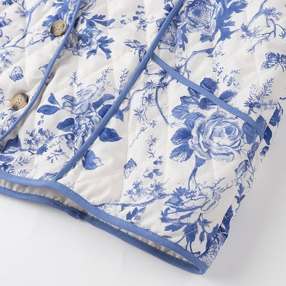 Blue  Floral Quilted Jacket is a timeless and elegant piece that offers both style and comfort. Featuring a classic blue-and-white floral pattern, this lightweight quilted jacket is perfect for layering during cooler seasons. 