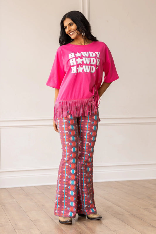 Aztec Flare Pants are a bold and stylish choice, designed to make a statement. These fitted pants feature a vibrant Aztec-inspired pattern and a flattering flared silhouette.