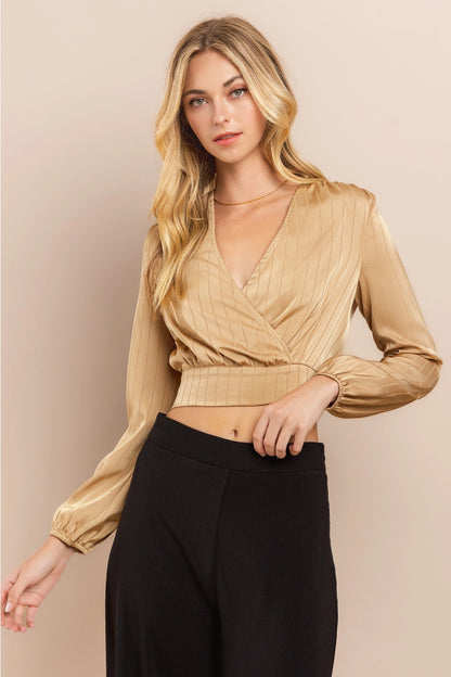 Beige Wrap Crop Top Made from lightweight polyester, this top features a flattering wrap design with a deep V-neckline and long sleeves.